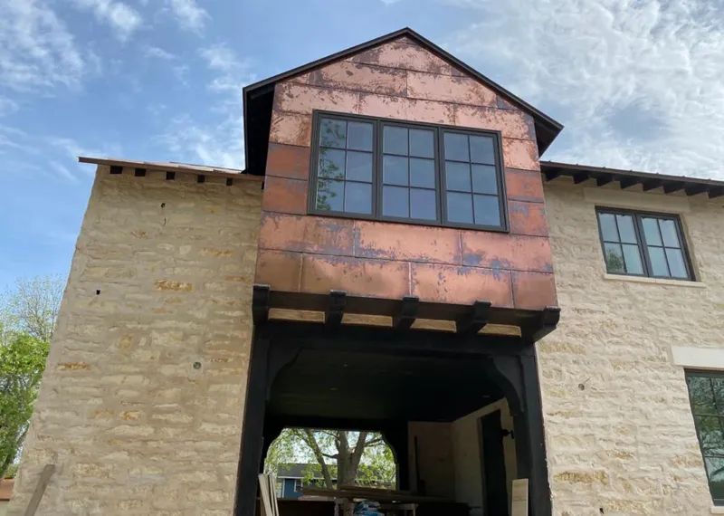 Copper metal panel facade on a stone building for Metal Roof Coating in Wilmington Island