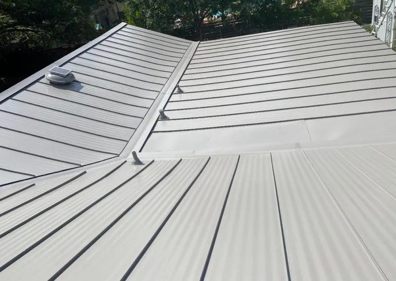 Solar attic fan installed on a metal roof for Roof Ventilation in Wilmington Island